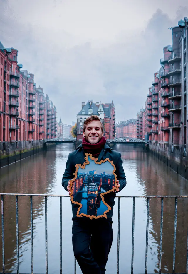 Holding a Germany Borderframe on a bridge in Hamburg’s Speicherstadt