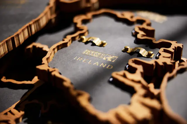 The backplate of an Ireland Borderframe with the engraved logo and brass hangers